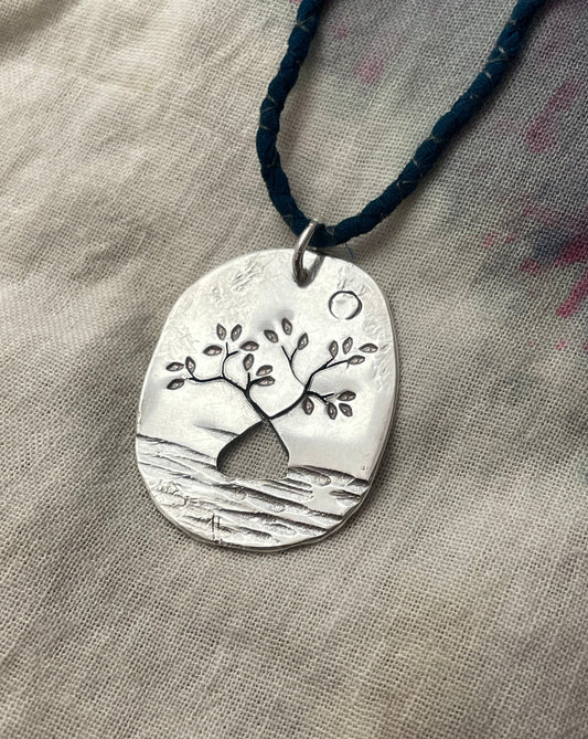 Oval tree pendant